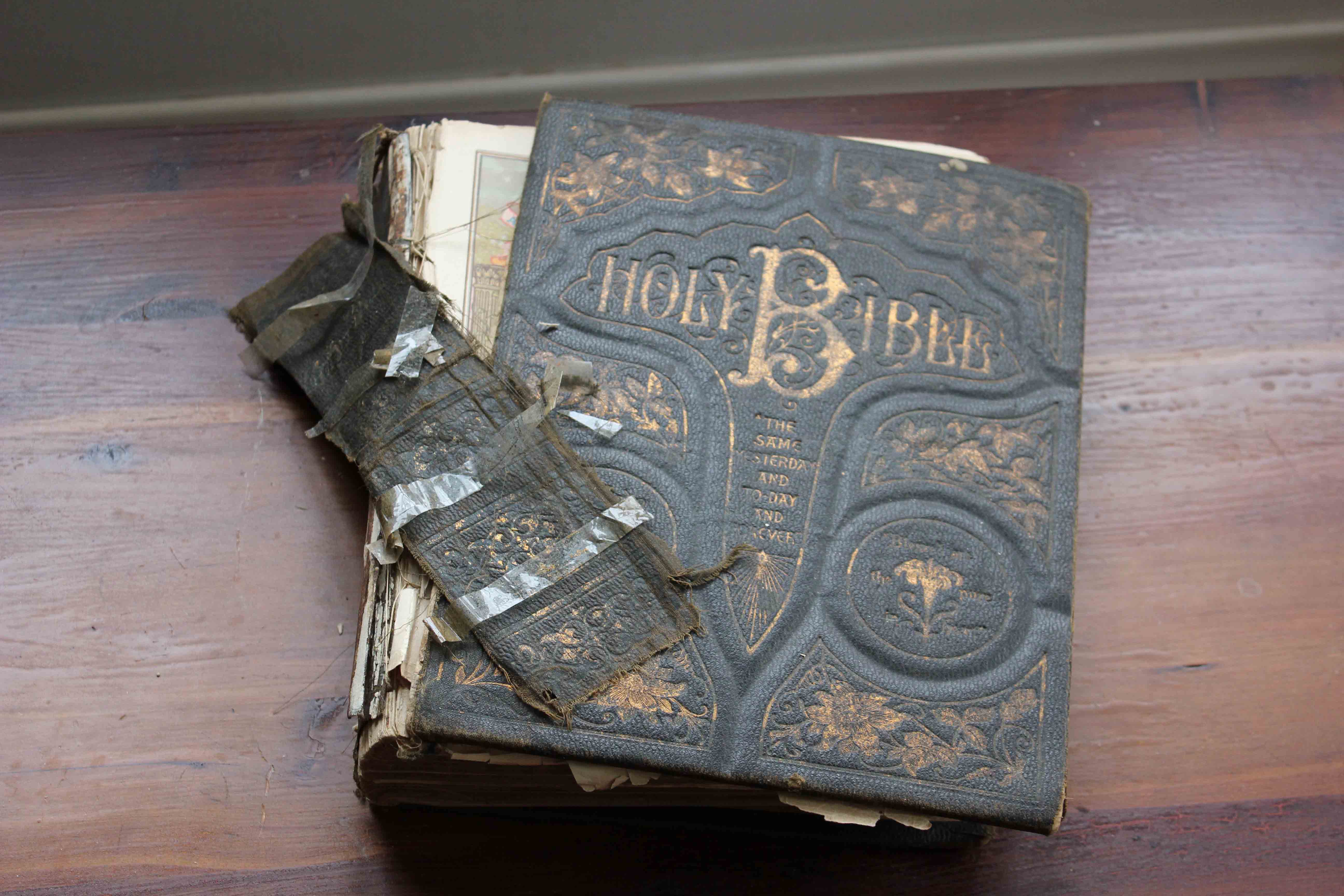 cloth family bible with broken cover and spine